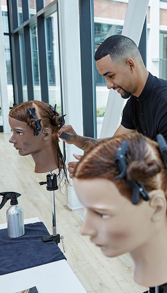 Student working on Pivot Point mannequins, snapcap