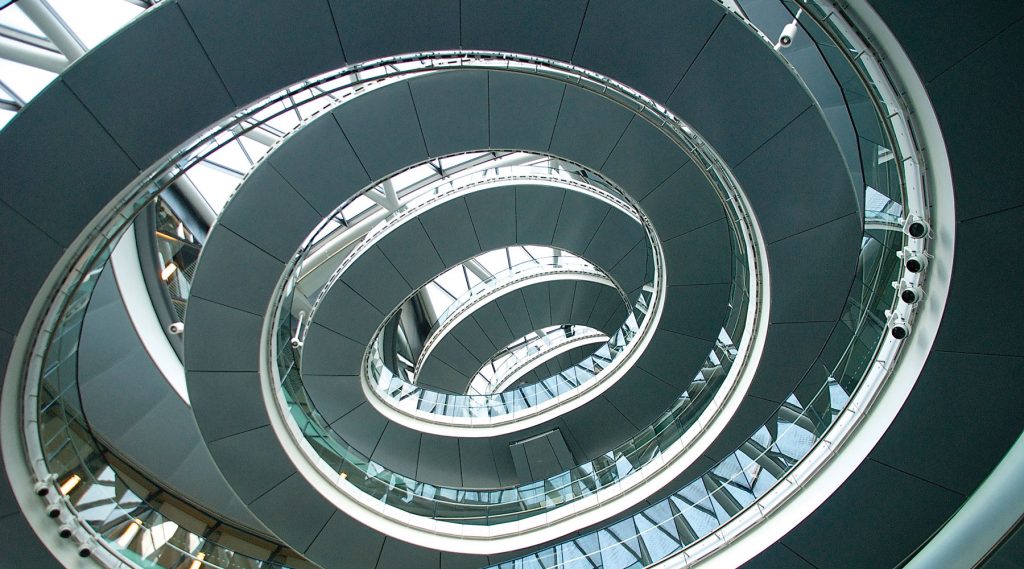 Tightening spiral walkway, evocative of long hair designs.