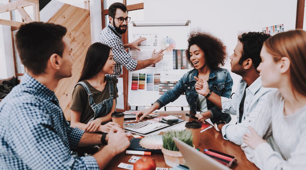 Presentation. Show. White Board. Design Studio. Multi-Ethnic. Project. Creative. Look. People. Designers. Young Specialists. Choose Colors for Design. Teamwork. Discussion. Brainstorming. Workplace.